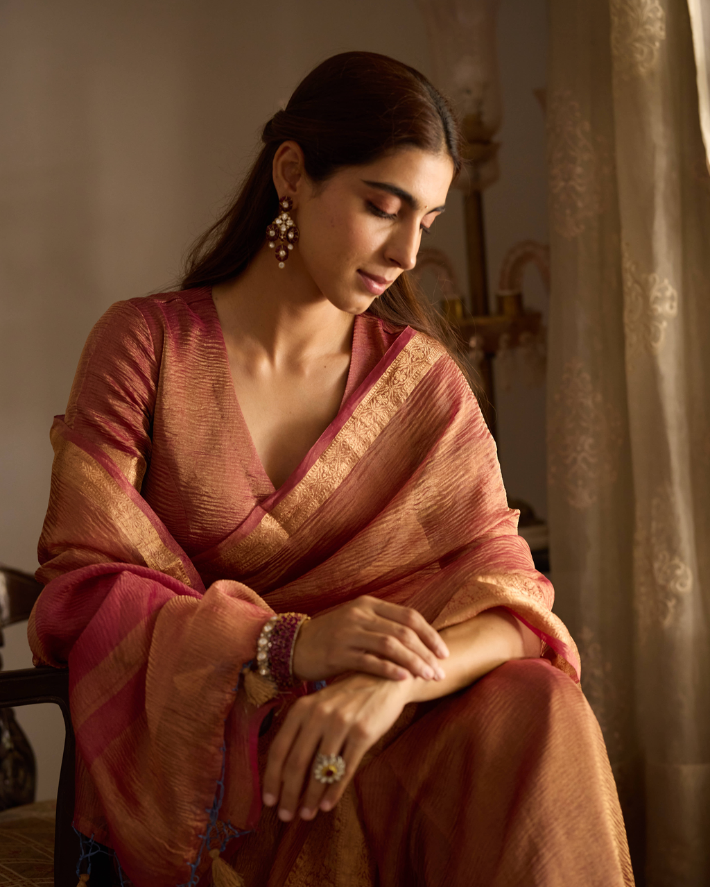 Mṛdula Brick Red Solid Crushed Tissue Saree